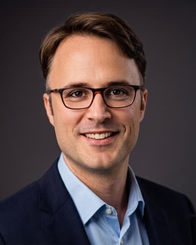 Portrait of Dr Alex Mathy